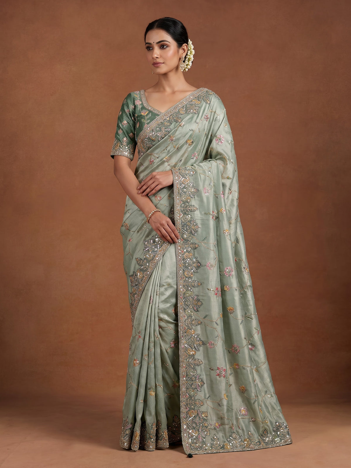 Pastel mint green pashmina saree with floral and bird embroidery