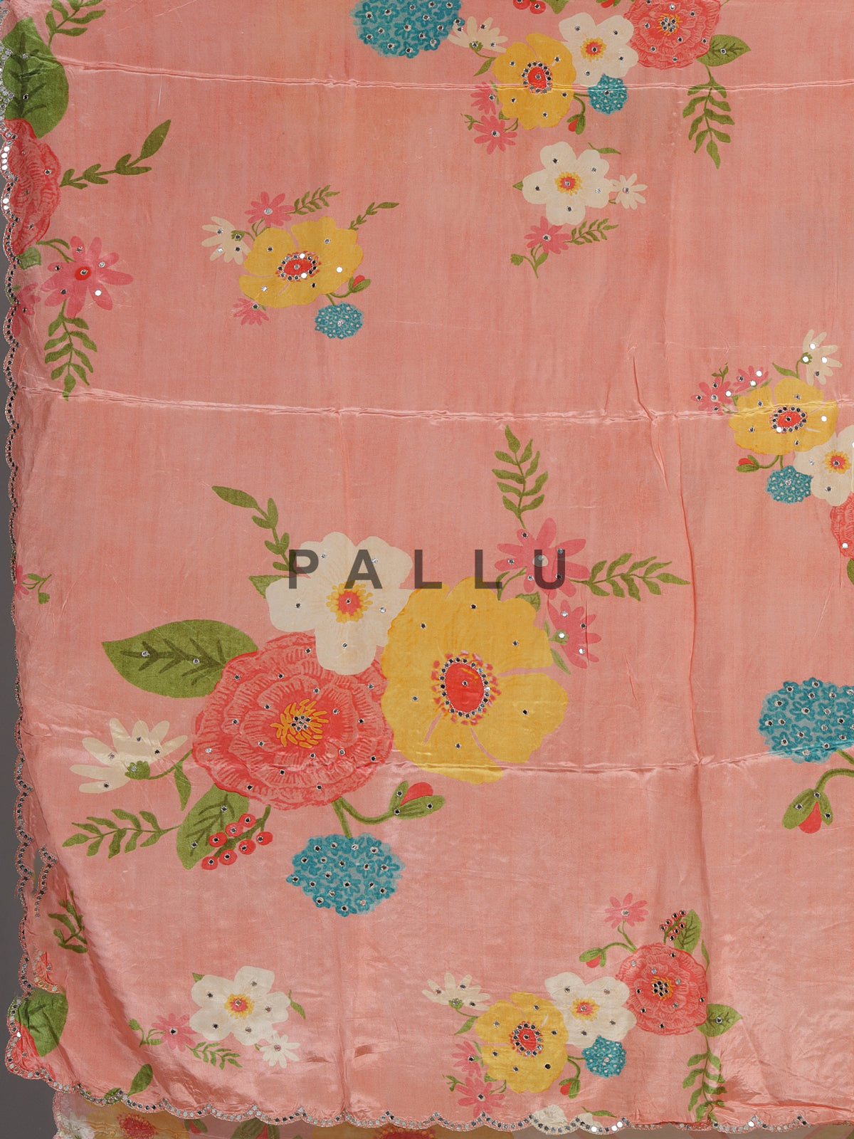 Peach crepe silk saree with floral prints and delicate aabla work