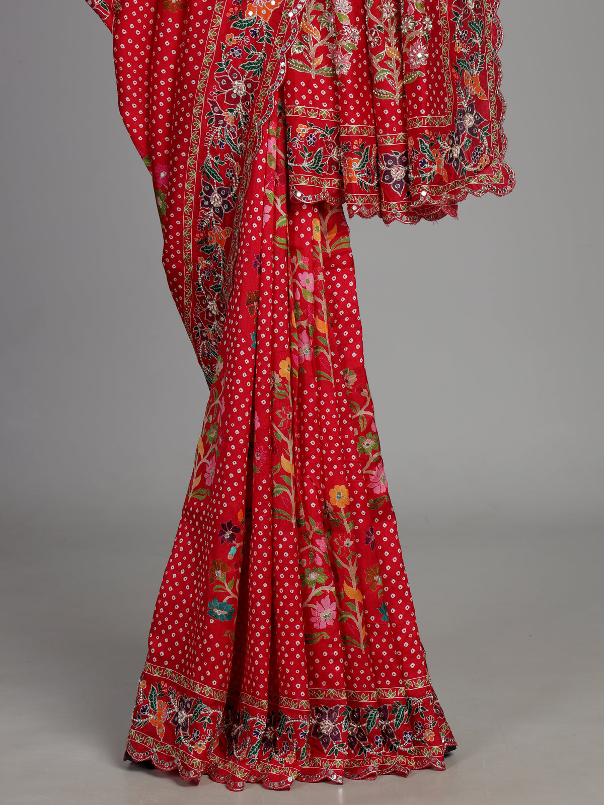 Red muslin silk saree with bandhani print and traditional aabla embellishments