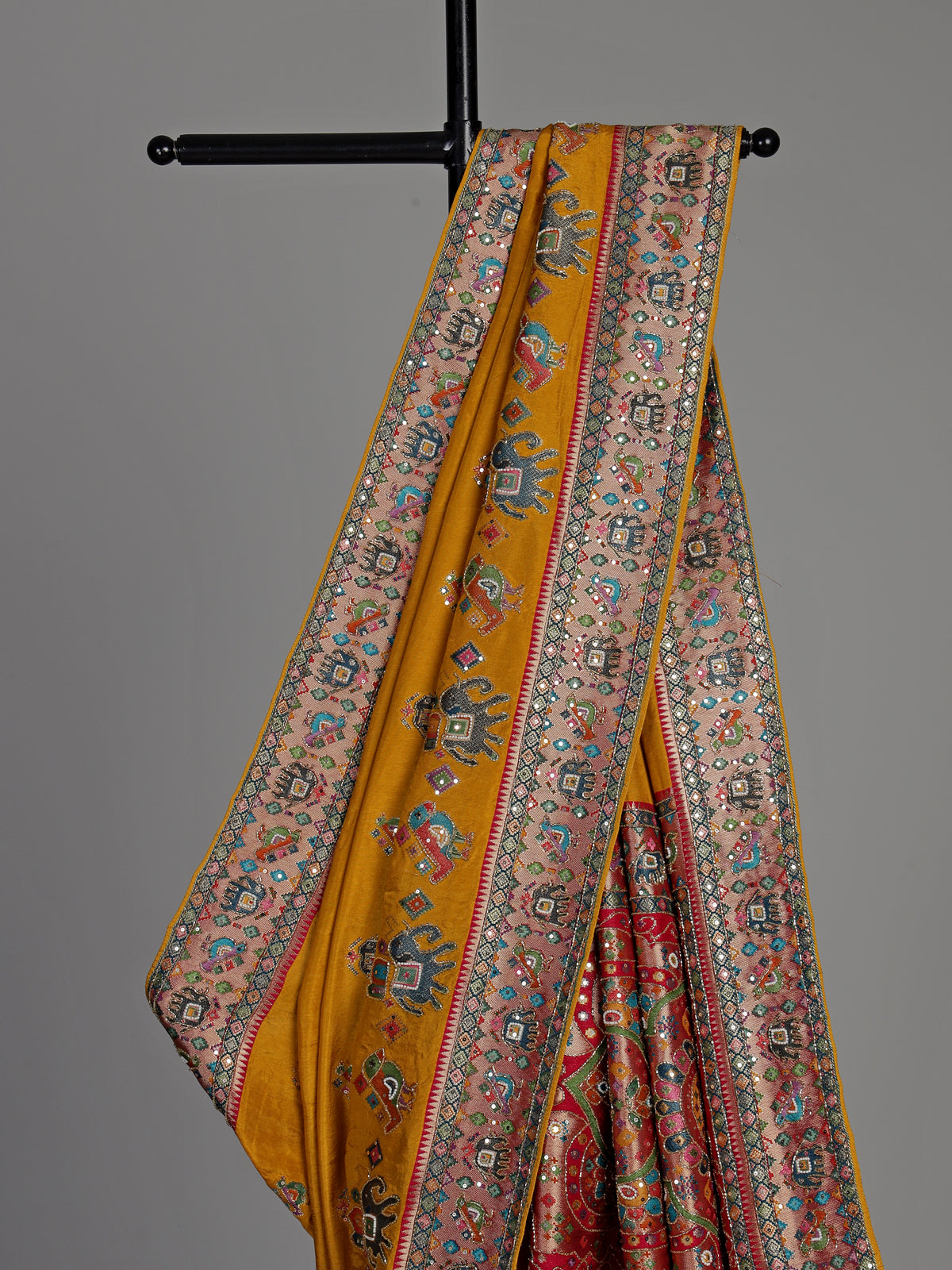 Mustard yellow pashmina saree with elephant motifs and contrasting pallu