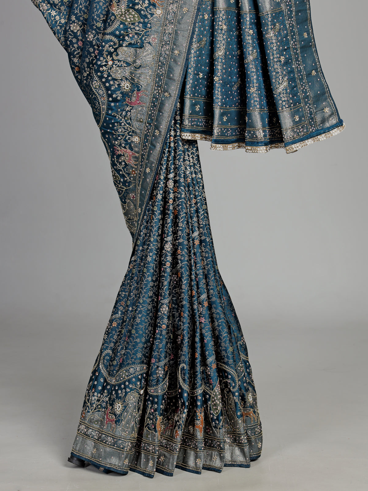 Teal blue semi silk saree with artistic animal and bird motifs