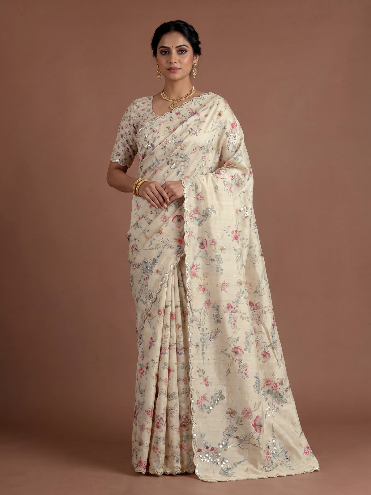 Cream tusser silk saree with floral prints and embellished beadwork