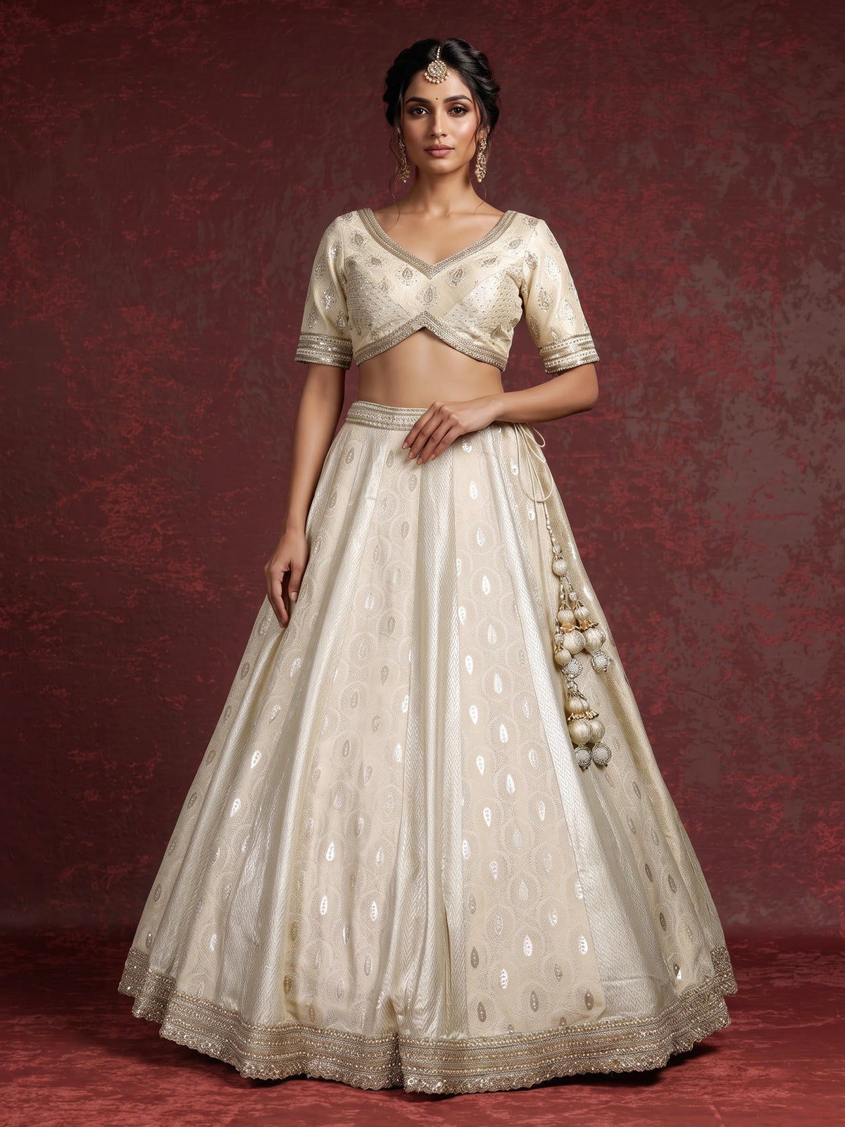 Cream banarasi silk lehenga choli with intricate zardosi embellishments