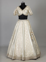 Cream banarasi silk lehenga choli with intricate zardosi embellishments