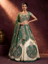 Green silk lehenga choli with intricate zardosi and tassel detailing