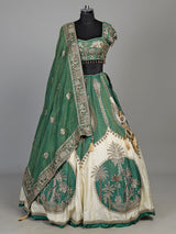 Green silk lehenga choli with intricate zardosi and tassel detailing