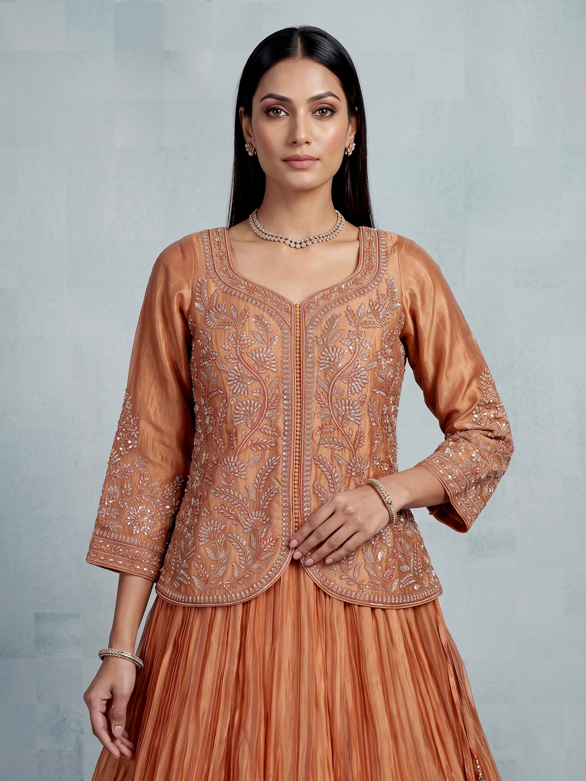 Pastel peach tissue silk lehenga choli with embellished sweetheart neckline