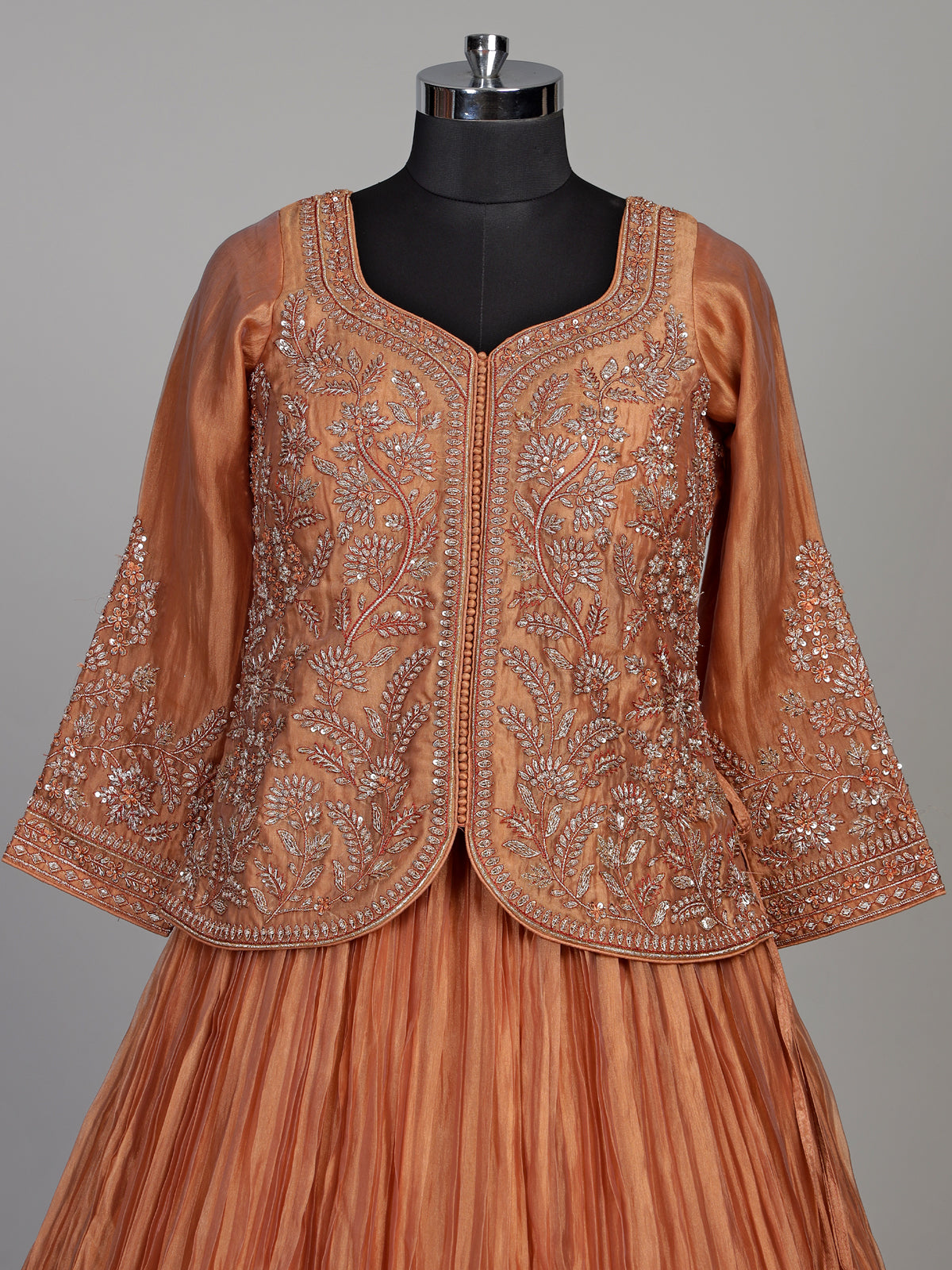 Pastel peach tissue silk lehenga choli with embellished sweetheart neckline