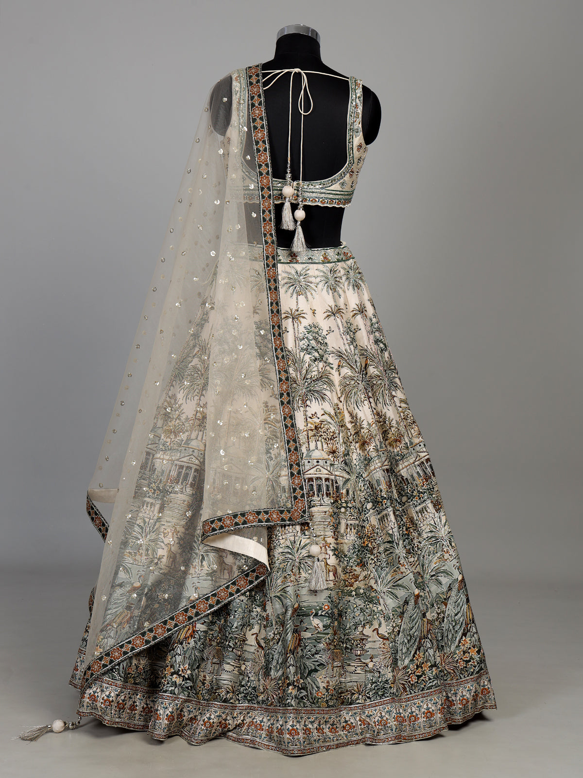 Cream silk printed lehenga choli with intricate zardosi and gota work