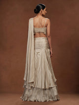 Cream chiffon georgette lehenga choli with pearl and tassel embellishments