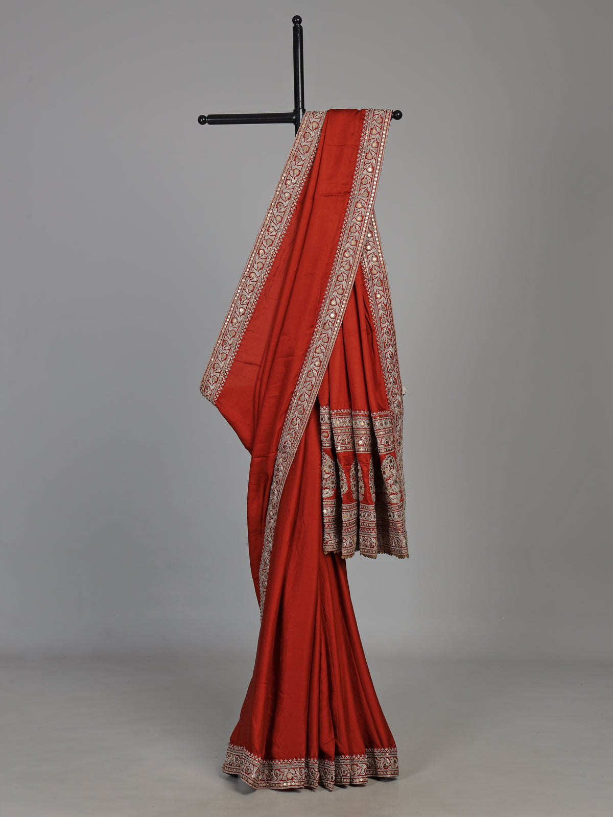 Elegant rust red silk saree with embroidered pallu and sequins