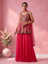 Rani pink silk palazzo suit with mirror work and net dupatta