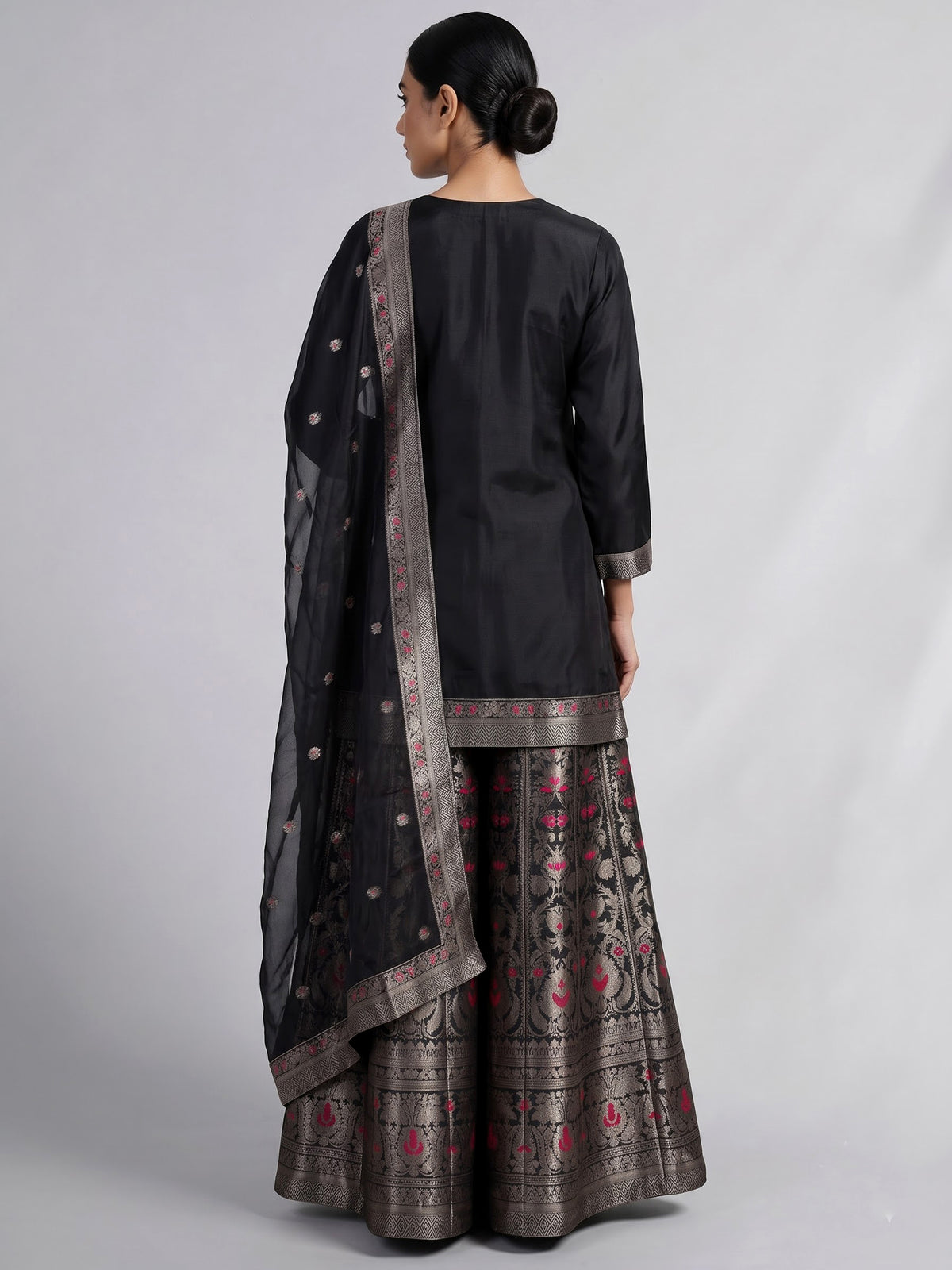 Black banarasi silk palazzo suit with an ornate zari yoke