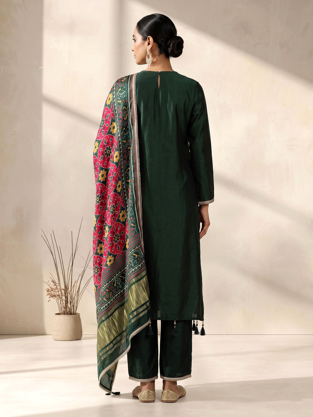 Bottle green silk anarkali suit with patola printed dupatta