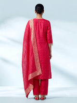 Rani pink silk bandhani suit with an embellished yoke