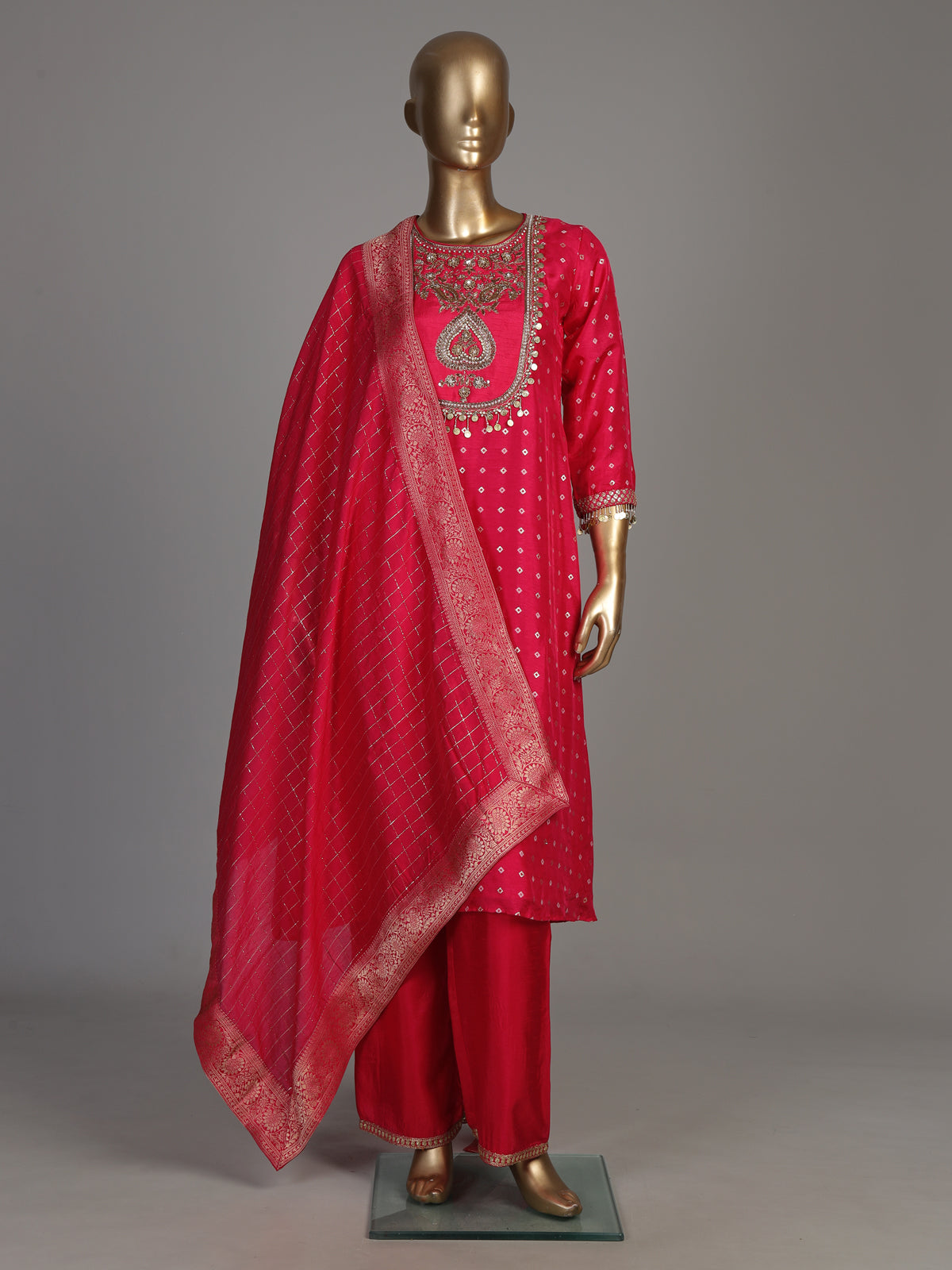 Rani pink silk bandhani suit with an embellished yoke