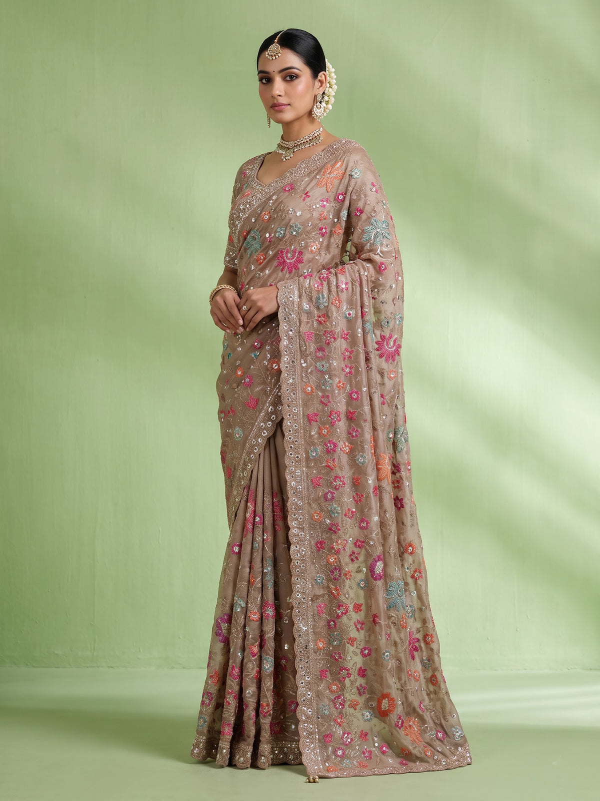 Coffee brown tissue silk saree with floral embroidery and tassels