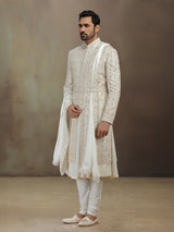 Cream silk peshwai groom sherwani with dupatta