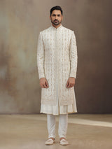 Cream silk peshwai groom sherwani with dupatta