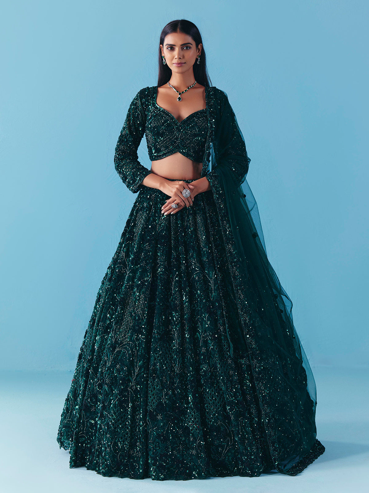 Dark green net lehenga choli with stone and sequins detail