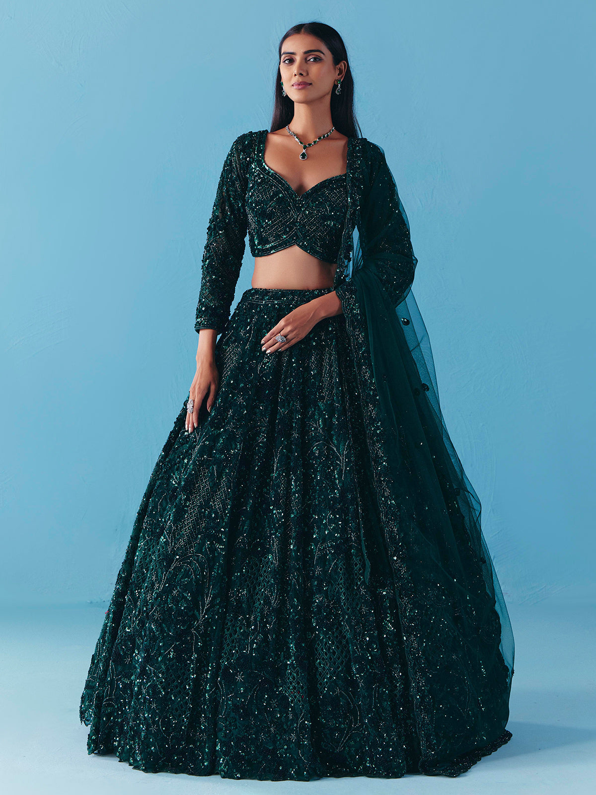 Dark green net lehenga choli with stone and sequins detail