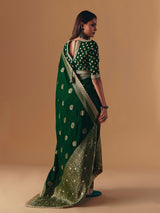 Dark green silk saree with heavy work blouse