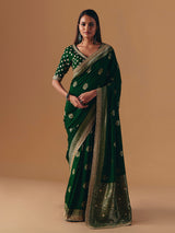 Dark green silk saree with heavy work blouse