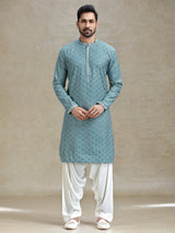 English green serene kurta set in symmetrical embroidery