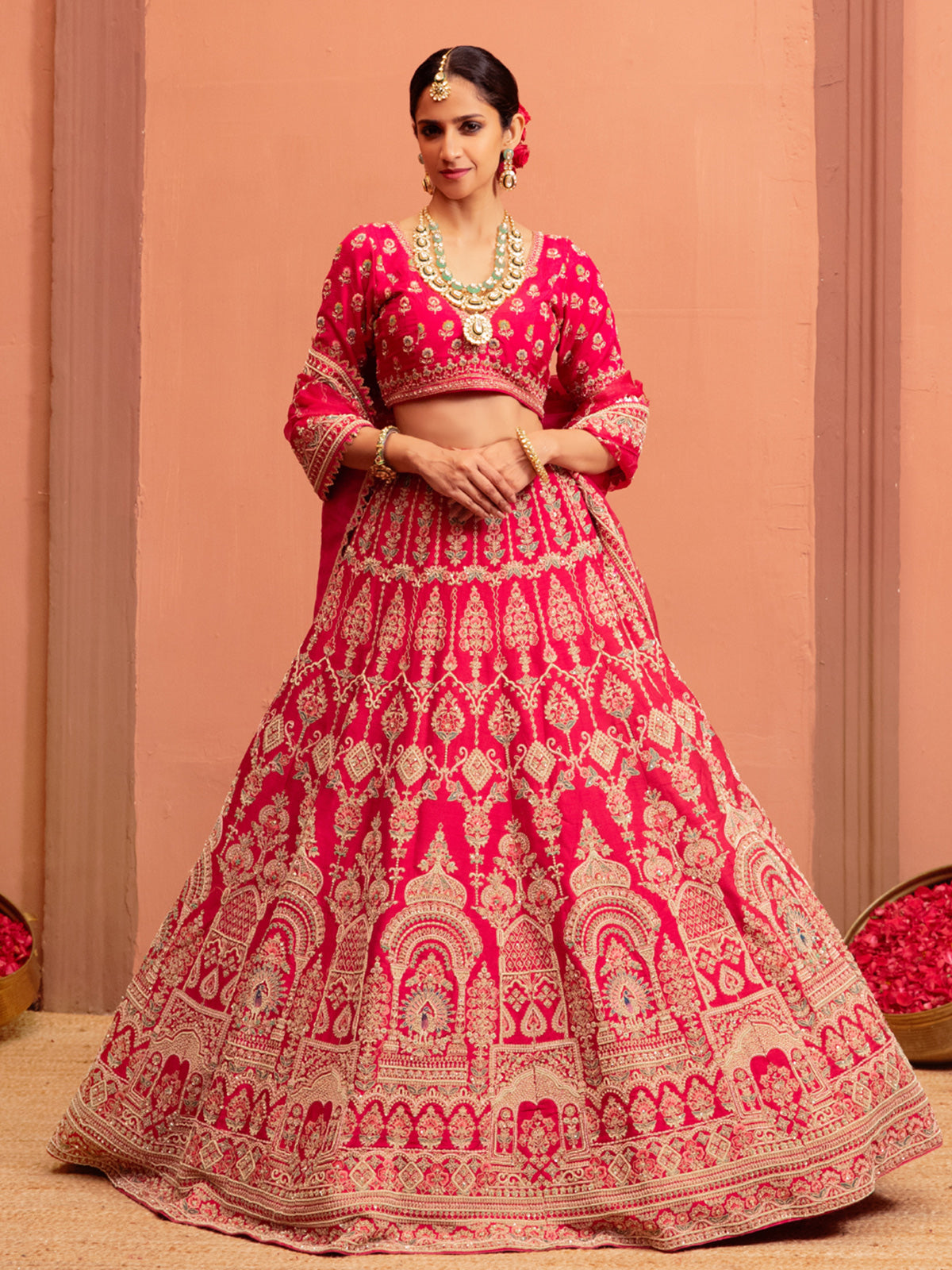 Magenta raw silk bridal lehenga choli with embellishments
