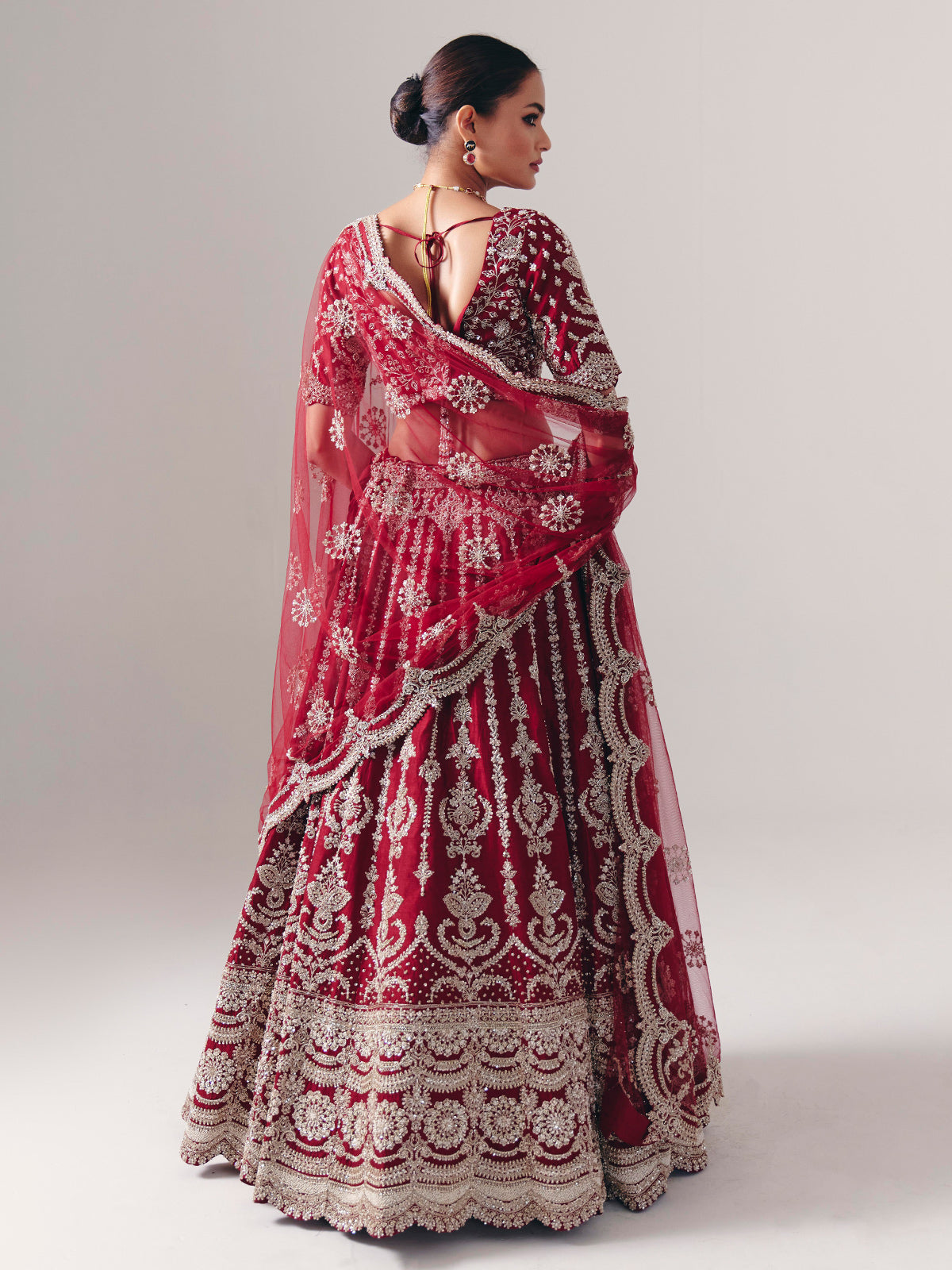 Maroon raw silk lehenga choli with zardosi and resham glow