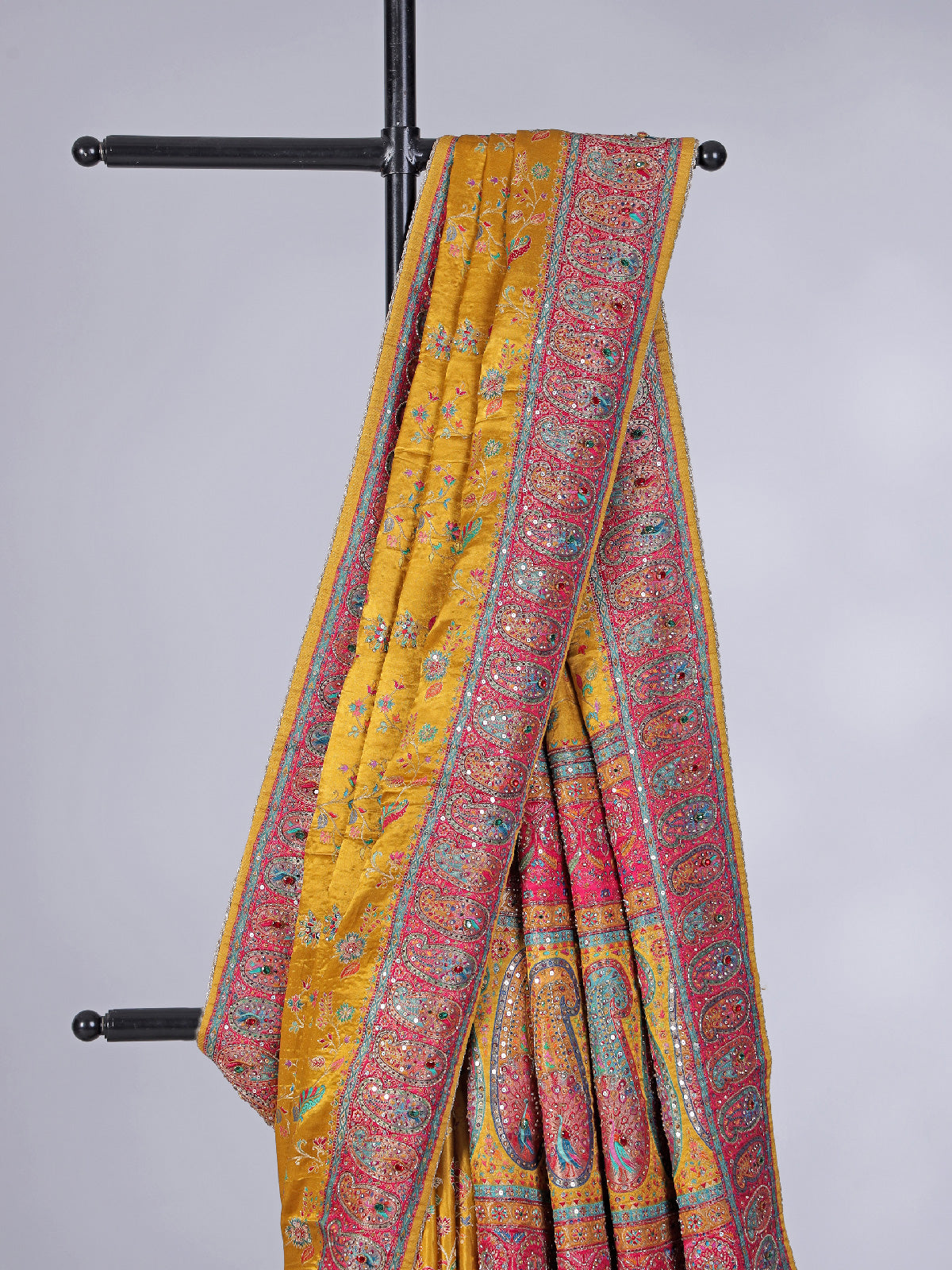 Mustard yellow modal silk saree with colorful motifs