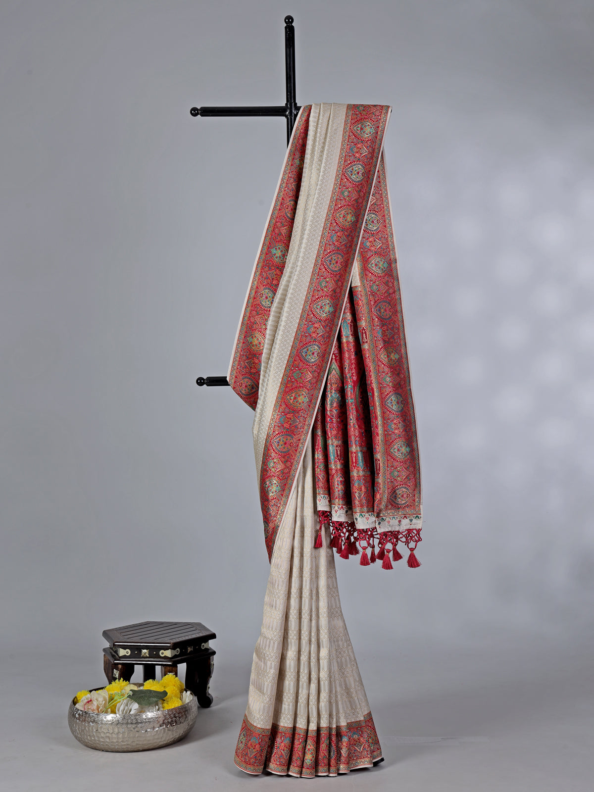Off white dola silk saree with colorful motifs