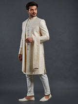 Cream raw silk groom style sherwani with rich embellishment