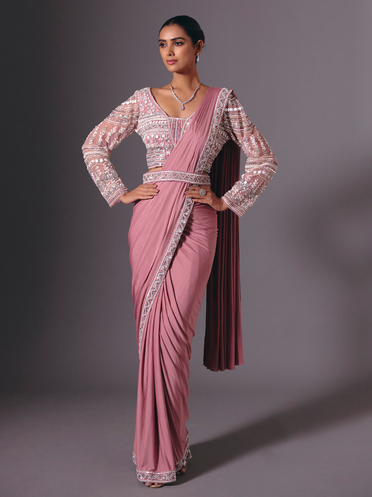 Onion pink lycra saree with heavy festive embellishments