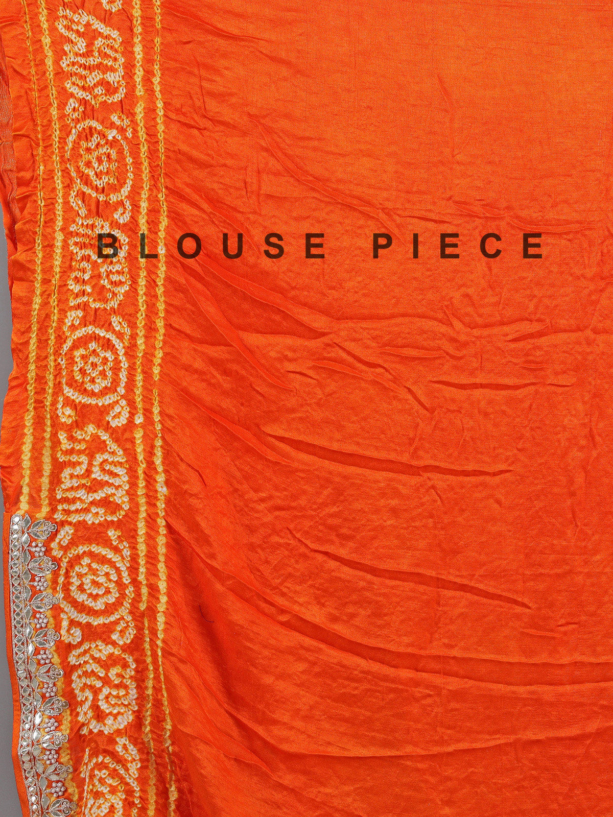 Orange bandhani saree with beaded detailing