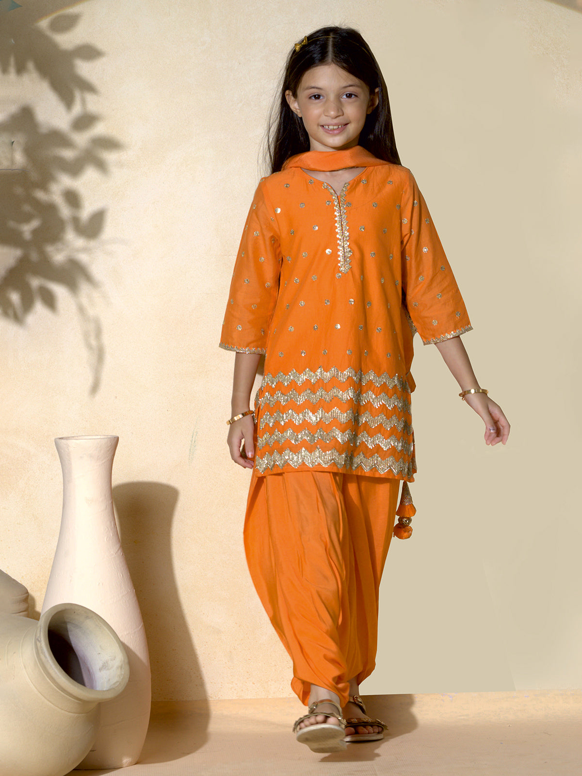 Orange punjabi girls salwar suit with resham and sequins
