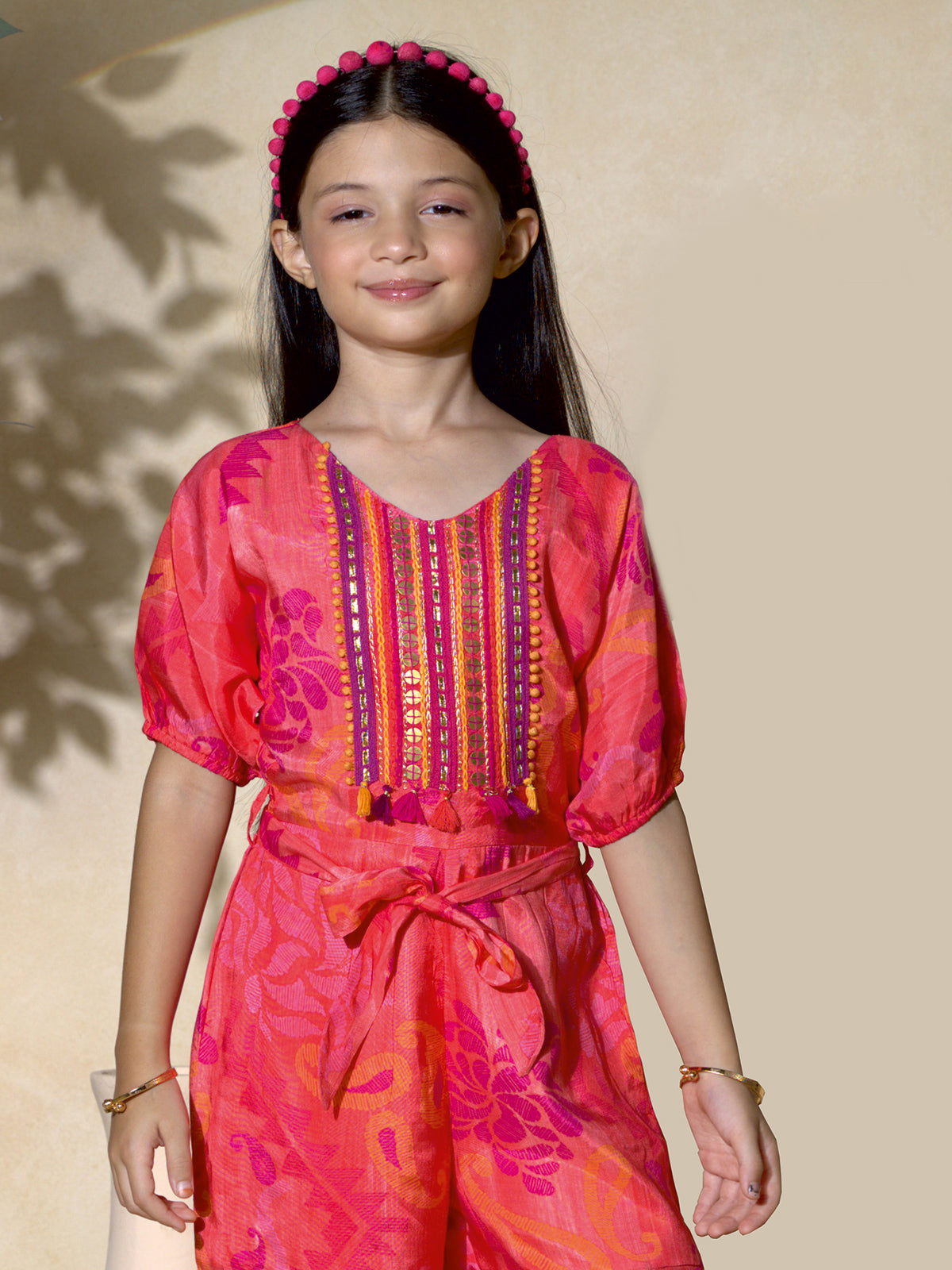 Orange silk belted jumpsuit for girls party wear