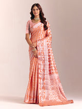 Peach silk saree accented with classic zari work