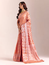Peach silk saree accented with classic zari work