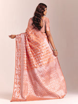 Peach silk saree accented with classic zari work