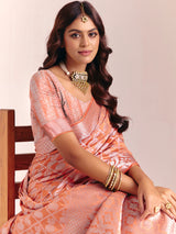Peach silk saree accented with classic zari work