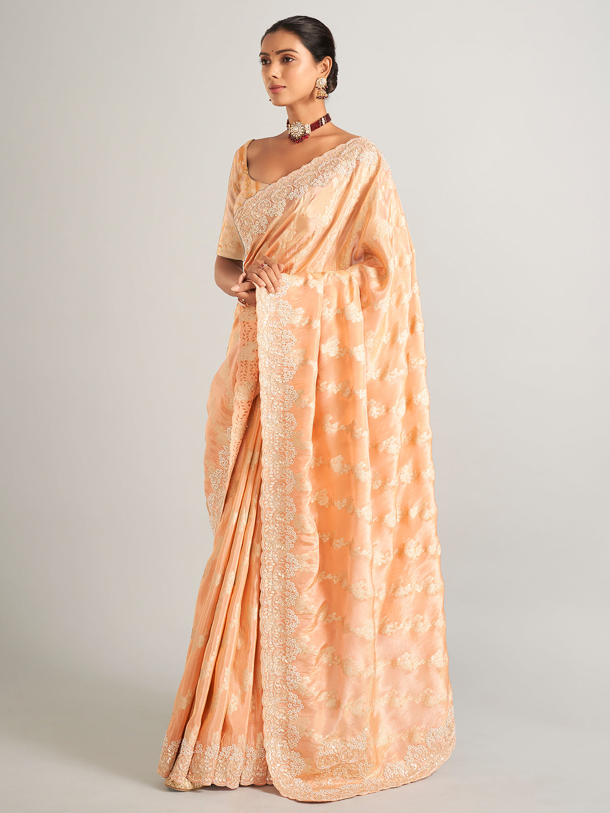 Peach silk zari worked saree with unstitched blouse