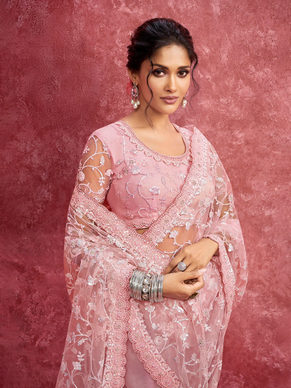 Pink net saree with sequins work for reception