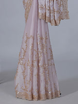 Pink tissue silk saree with sequins and resham accents