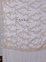 Pink tissue silk saree with sequins and resham accents