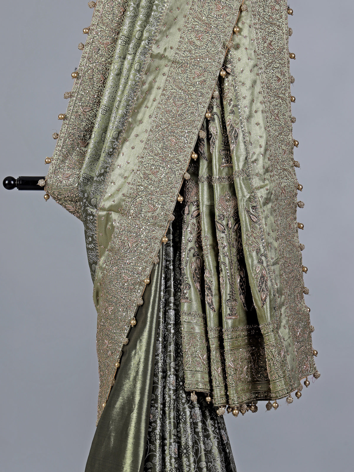 Pista green kanjivaram silk saree with ornate embellishments