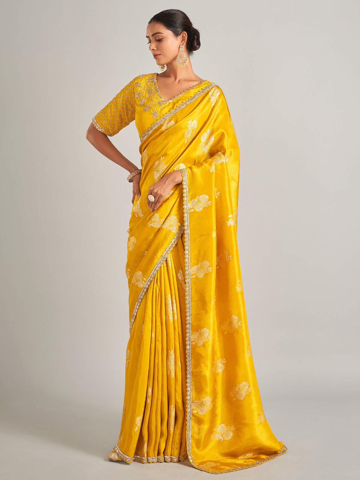 Radiant mustard yellow silk saree with zari work