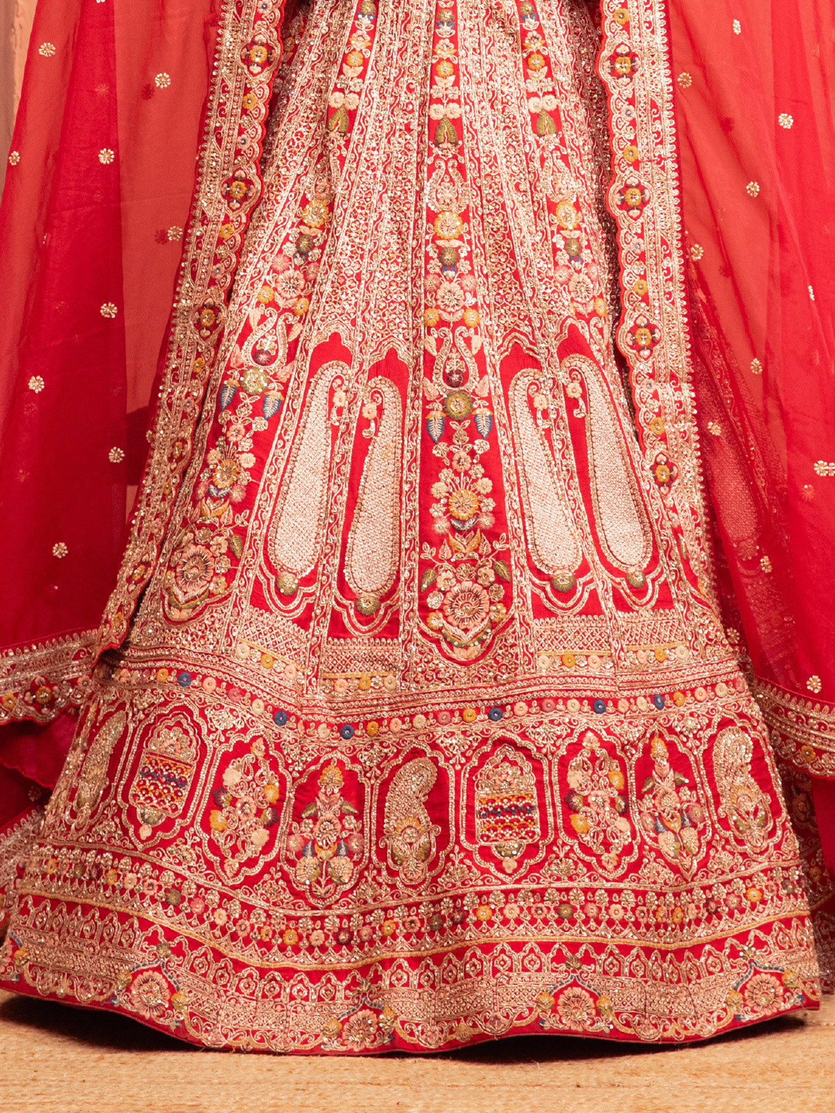 Red bridal lehenga choli with embellished blouse