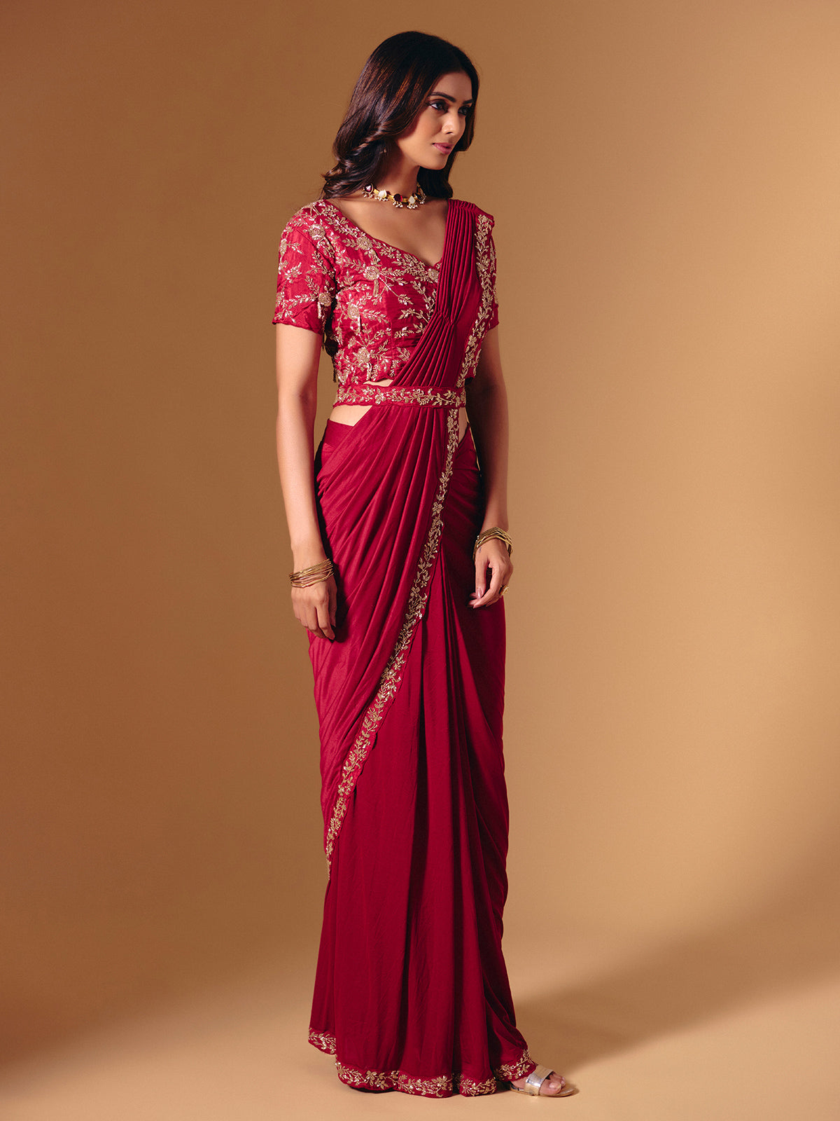 Red satin lycra saree with dazzling cutdana accents
