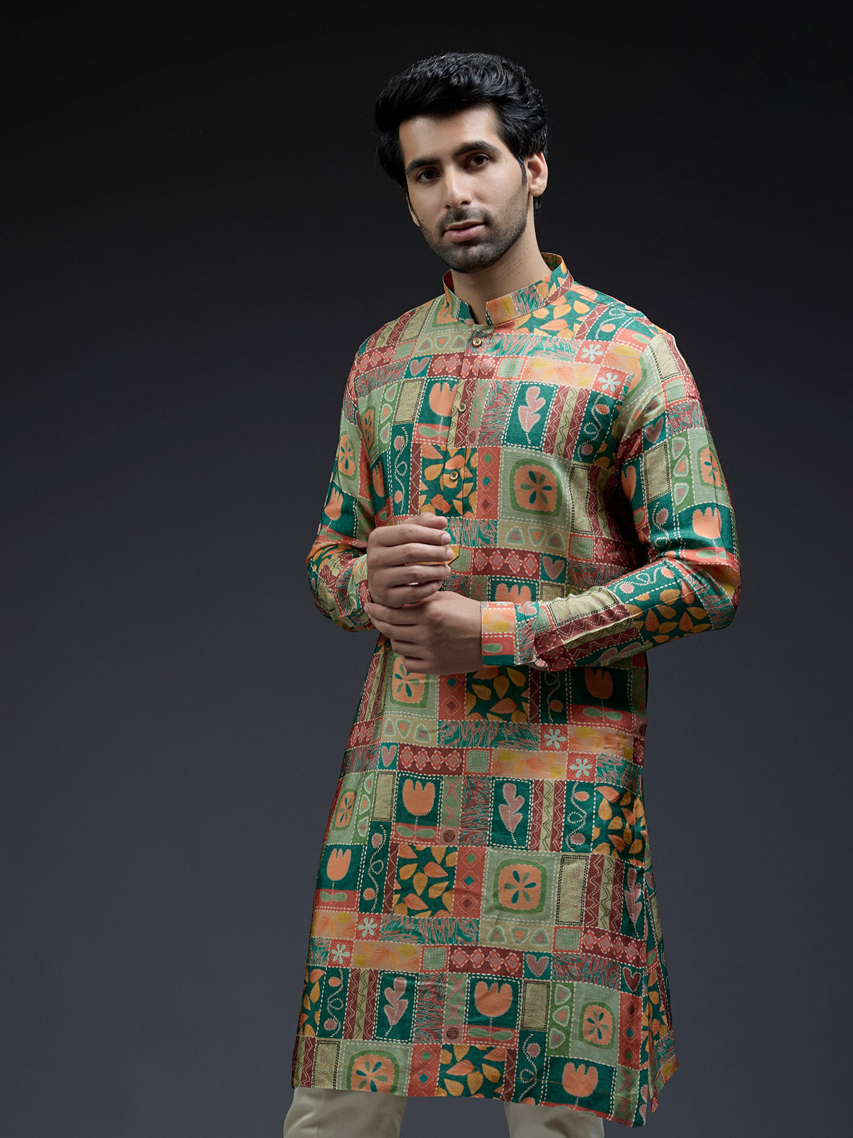 Rich silk green kurta suit in unique ethnic print